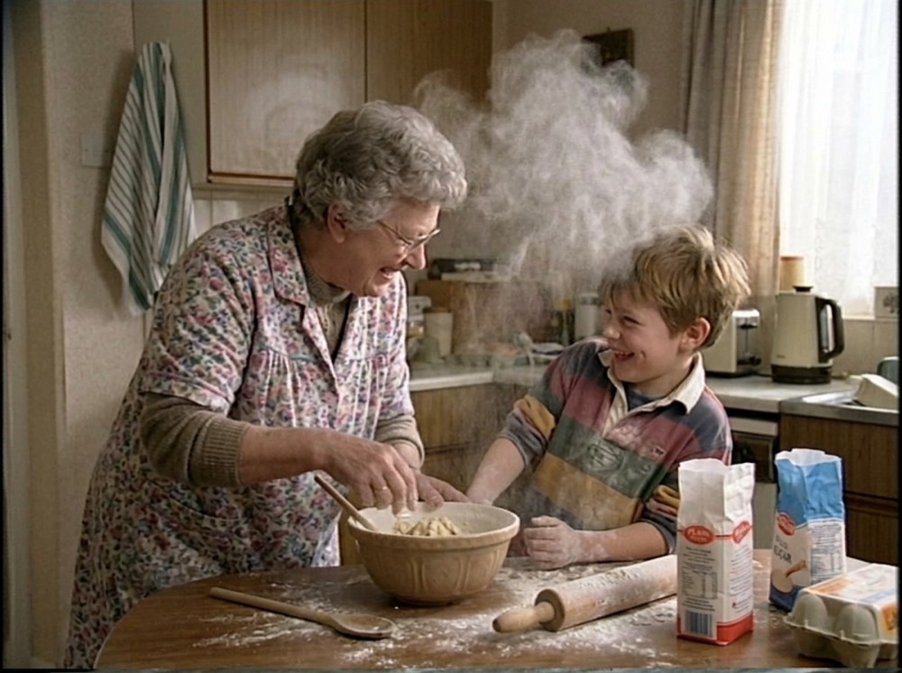 A granny and grandchild baking